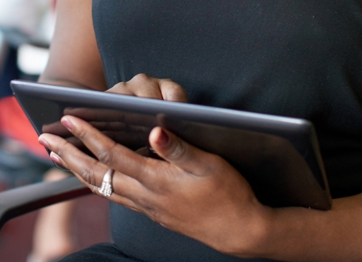 Picture of a computer tablet in a woman's hands